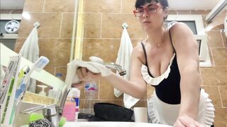 Milf with big boobs is cleaning the house